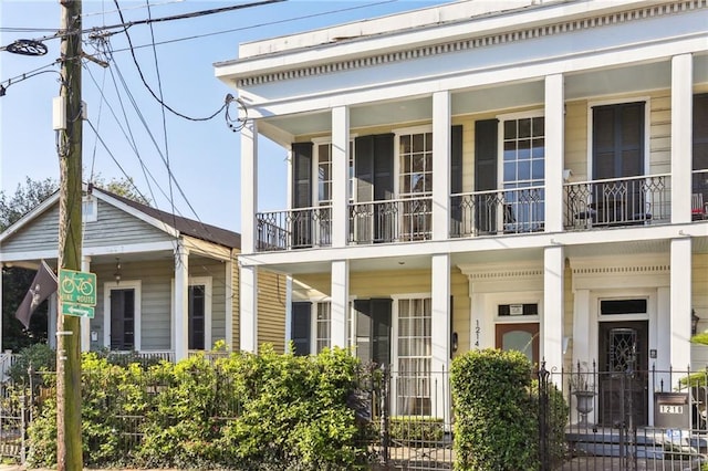 1214 Felicity St, New Orleans, LA 70130 - rear view of house featuring a balcony and covered porch