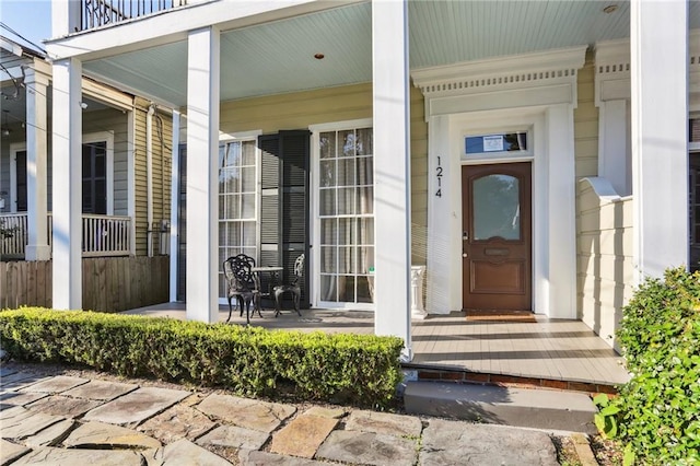 doorway to property featuring covered porch