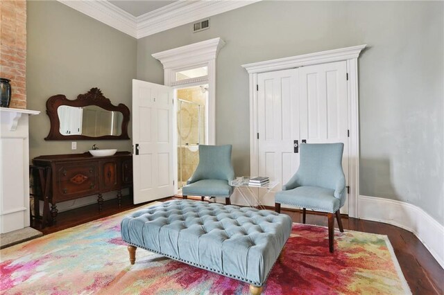 1214 Felicity St, New Orleans, LA 70130 - living area featuring wood finished floors and ornamental molding
