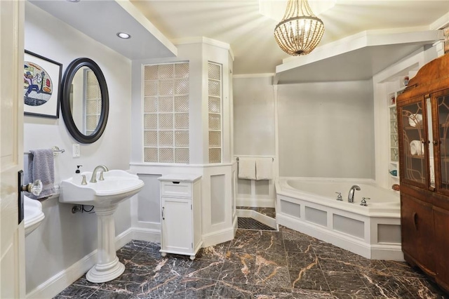 1214 Felicity St, New Orleans, LA 70130 - full bathroom with a bath, a chandelier, marble finish floors, baseboards, and recessed lighting