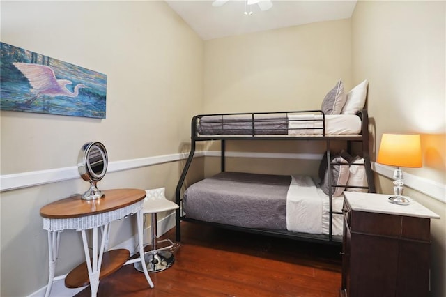 bedroom with dark wood-type flooring and ceiling fan