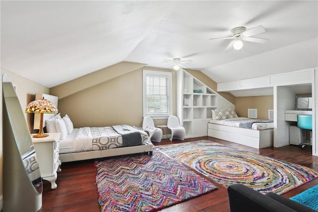 bedroom with dark wood-type flooring, ceiling fan, and vaulted ceiling