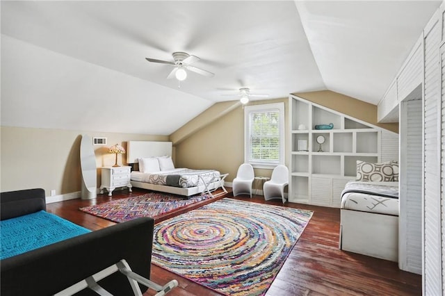 bedroom featuring dark hardwood / wood-style floors, vaulted ceiling, and ceiling fan