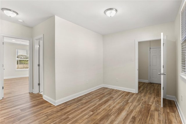 spare room featuring hardwood / wood-style floors