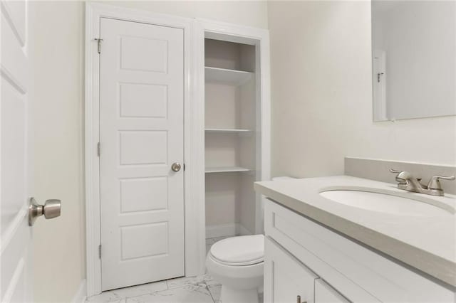 bathroom with vanity and toilet