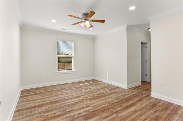 unfurnished room with crown molding, light wood-type flooring, and ceiling fan