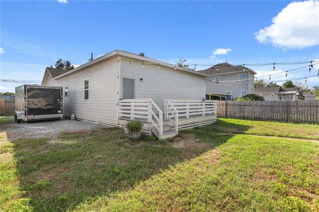 rear view of house with a lawn