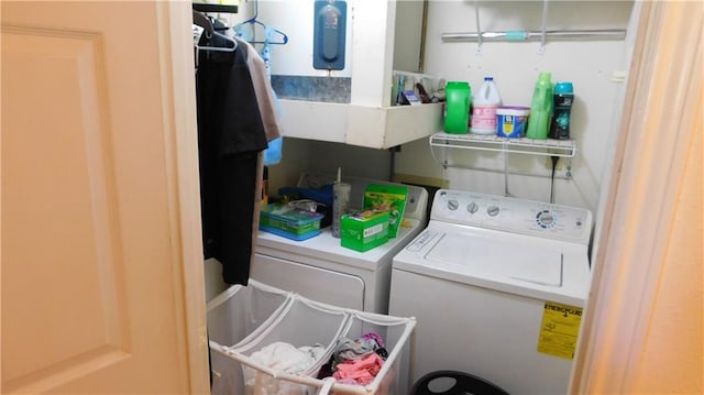 laundry area featuring washing machine and clothes dryer