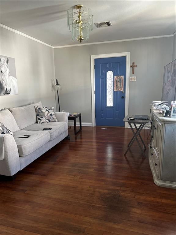 living area featuring crown molding, dark wood finished floors, baseboards, and visible vents
