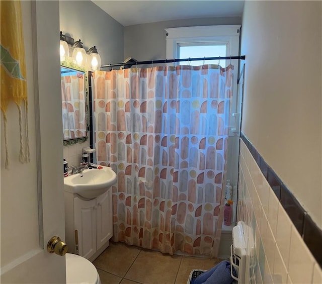 full bath with tile patterned flooring, vanity, toilet, tile walls, and a shower with shower curtain