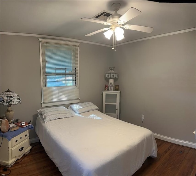 bedroom featuring a ceiling fan, visible vents, crown molding, dark wood finished floors, and baseboards