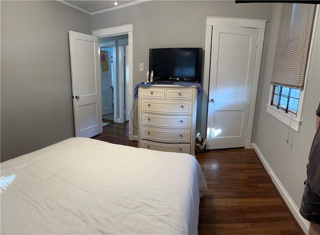 bedroom with dark wood-type flooring and ornamental molding