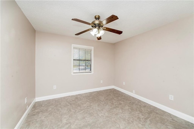 spare room featuring a textured ceiling and ceiling fan