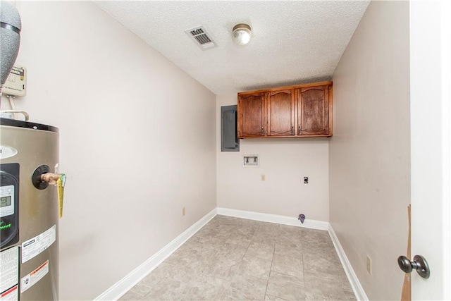 washroom featuring hookup for a washing machine, electric water heater, hookup for an electric dryer, cabinets, and a textured ceiling