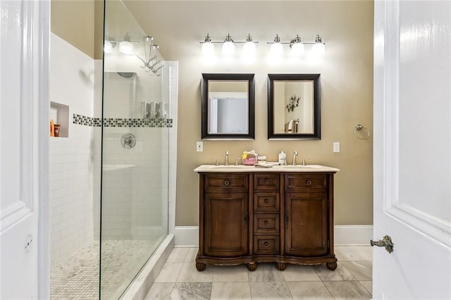 bathroom featuring vanity and a shower with door