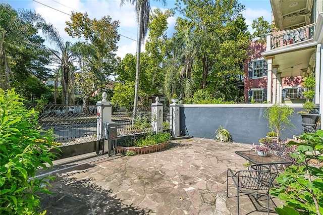 view of patio with a balcony