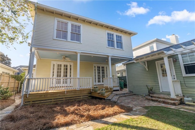 back of property featuring covered porch and ceiling fan