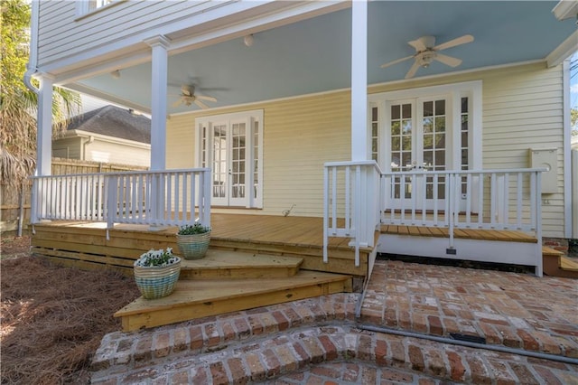 view of exterior entry featuring ceiling fan and french doors