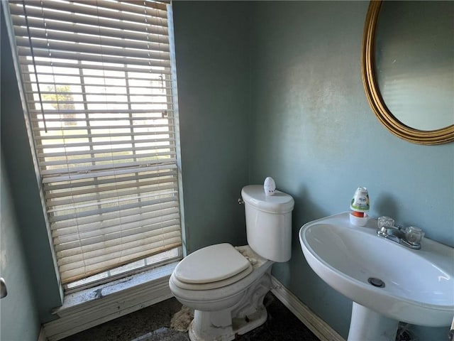 bathroom featuring toilet and sink