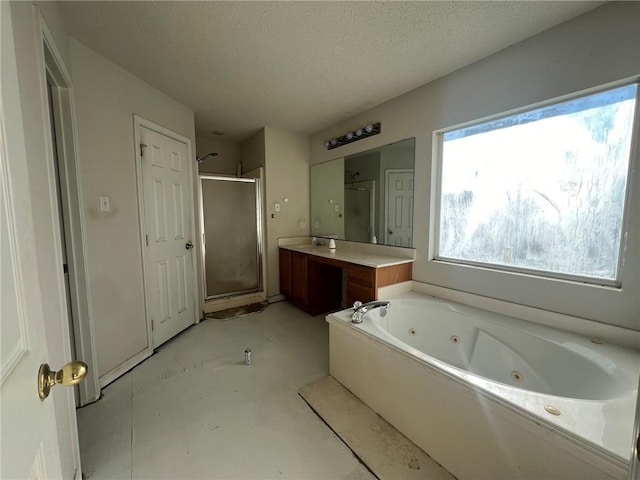 bathroom with vanity, concrete flooring, plus walk in shower, and a textured ceiling