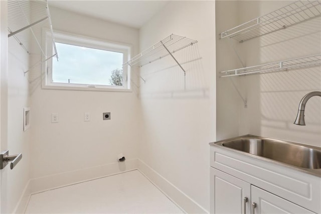 laundry area featuring cabinets, hookup for a washing machine, electric dryer hookup, and sink