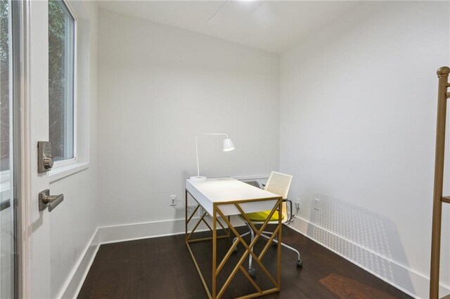 office with dark wood-type flooring