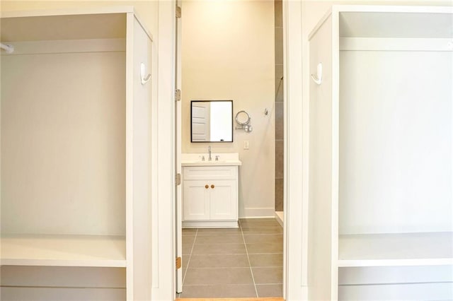 bathroom with tile patterned floors and vanity