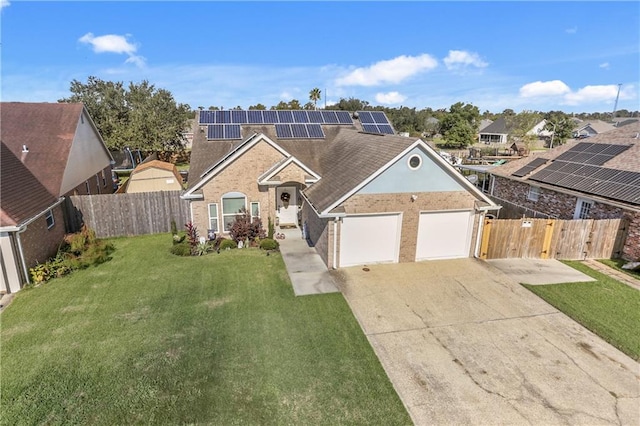 view of front of property with solar panels, a front lawn, and a garage