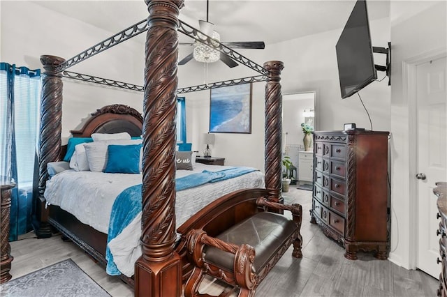 bedroom with ceiling fan and light wood-type flooring