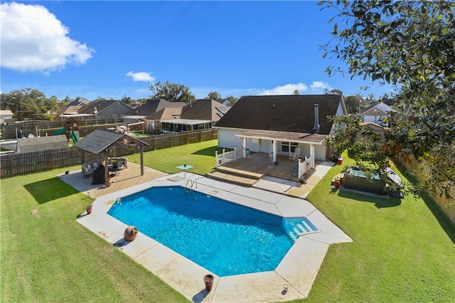 view of pool featuring a yard and a patio