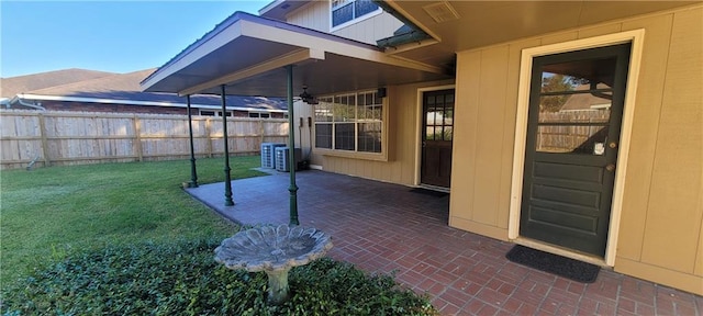 exterior space with a patio and central AC