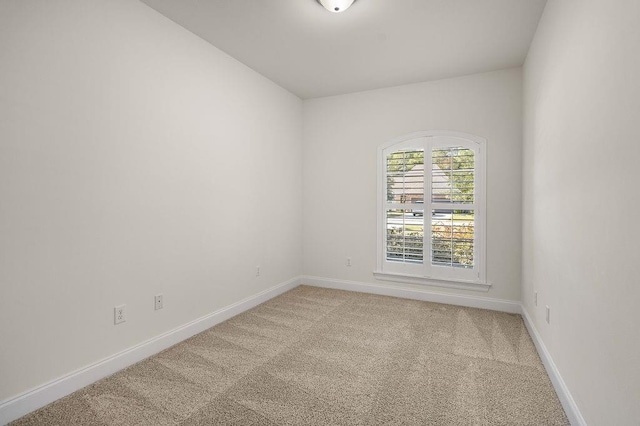 empty room with carpet flooring