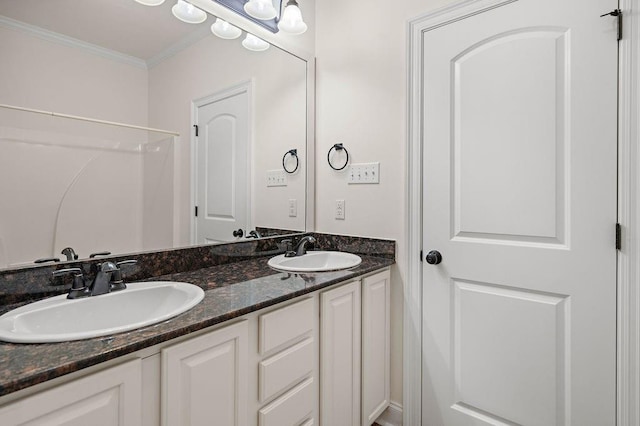 bathroom with vanity and ornamental molding