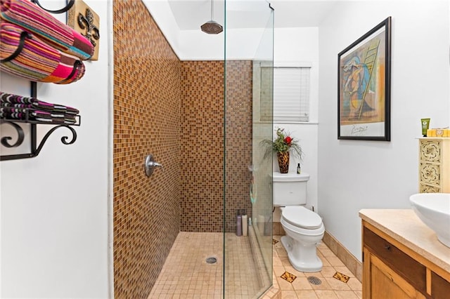 bathroom featuring vanity, toilet, tile patterned flooring, and an enclosed shower