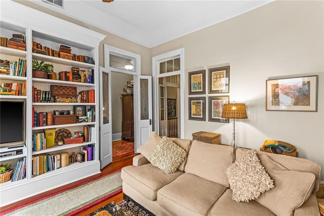 living area with hardwood / wood-style floors