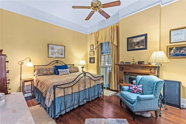 bedroom with dark wood-type flooring and ceiling fan