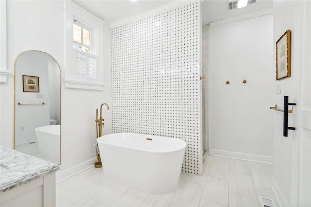 bathroom featuring vanity, crown molding, and shower with separate bathtub