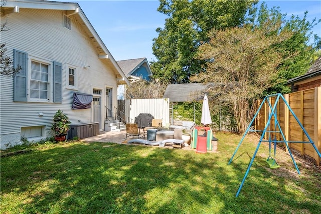 view of yard featuring a patio area and a playground