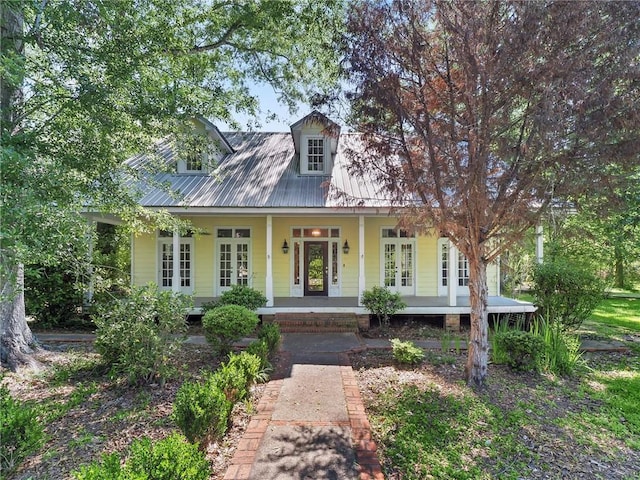 cape cod house with a porch