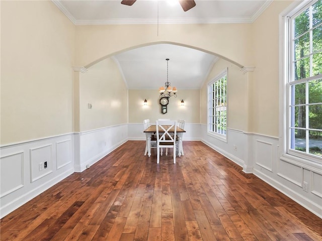 unfurnished dining area with crown molding, plenty of natural light, and dark hardwood / wood-style floors