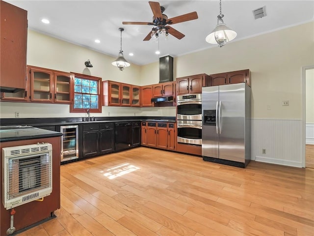 kitchen with beverage cooler, light hardwood / wood-style floors, hanging light fixtures, and appliances with stainless steel finishes