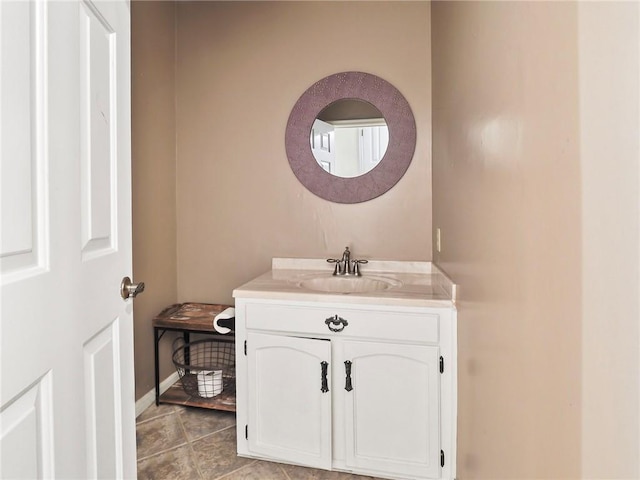 bathroom with tile patterned floors and vanity