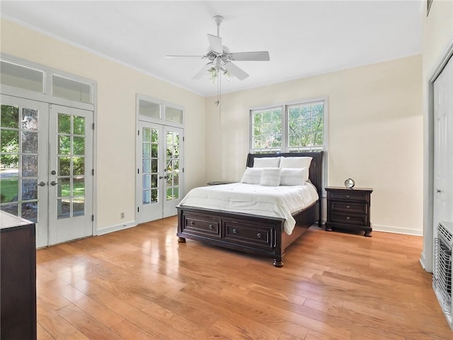 bedroom featuring access to exterior, ceiling fan, french doors, crown molding, and light hardwood / wood-style floors