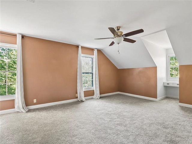 bonus room with carpet flooring, ceiling fan, and lofted ceiling