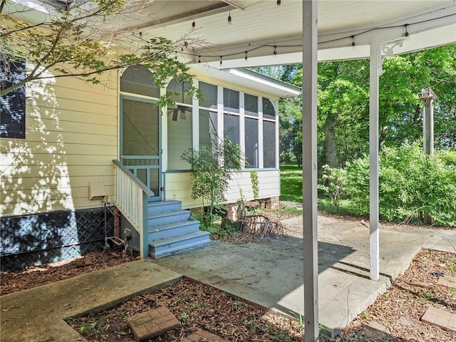 doorway to property featuring a patio