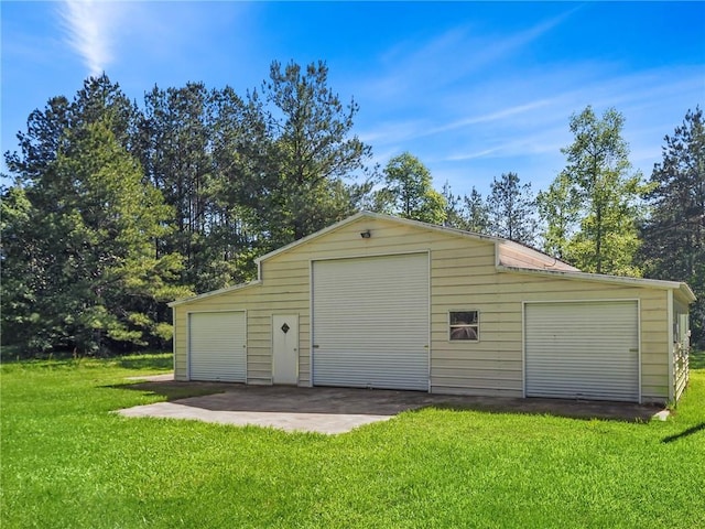 garage with a lawn