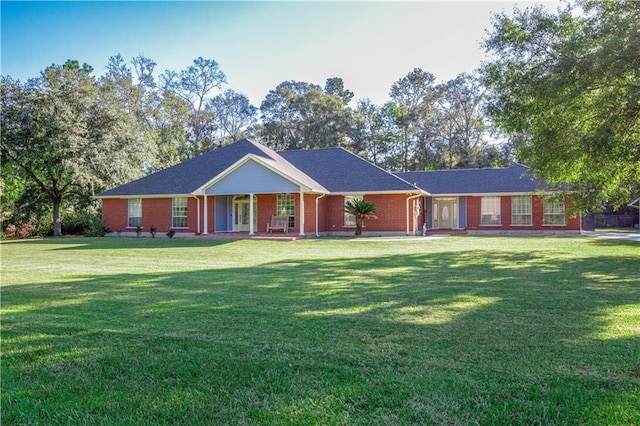 ranch-style home with a front lawn