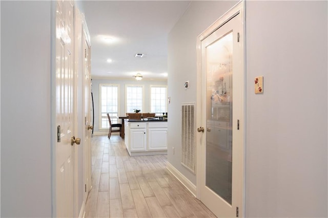 hall featuring light hardwood / wood-style flooring