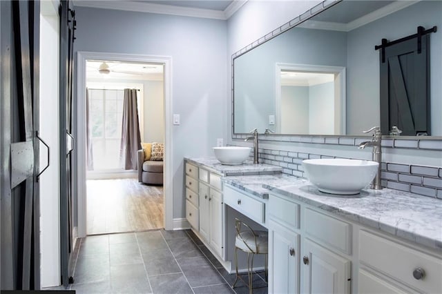 bathroom featuring vanity, decorative backsplash, and ornamental molding