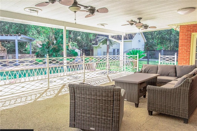 view of patio with outdoor lounge area and ceiling fan